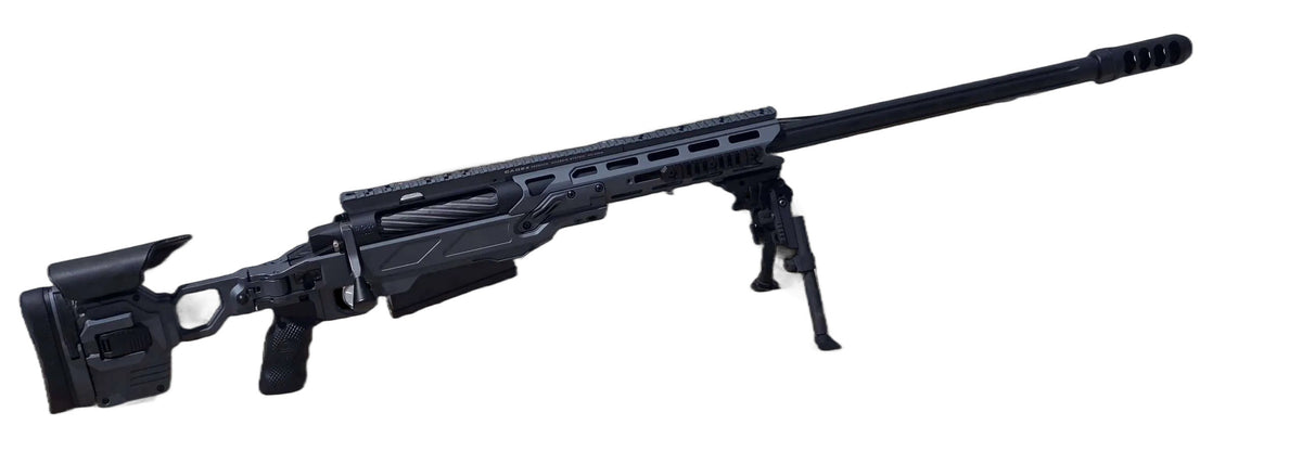 A modern bolt-action sniper rifle with an olive drab chassis, the B&B Firearms MCMILLAN TAC50C features a tactical adjustable stock, a black pistol grip, a twisted fluted barrel, and an expansion muzzle brake. This .50 BMG tactical rifle also includes a bipod for stability and a Picatinny rail for mounting optics.