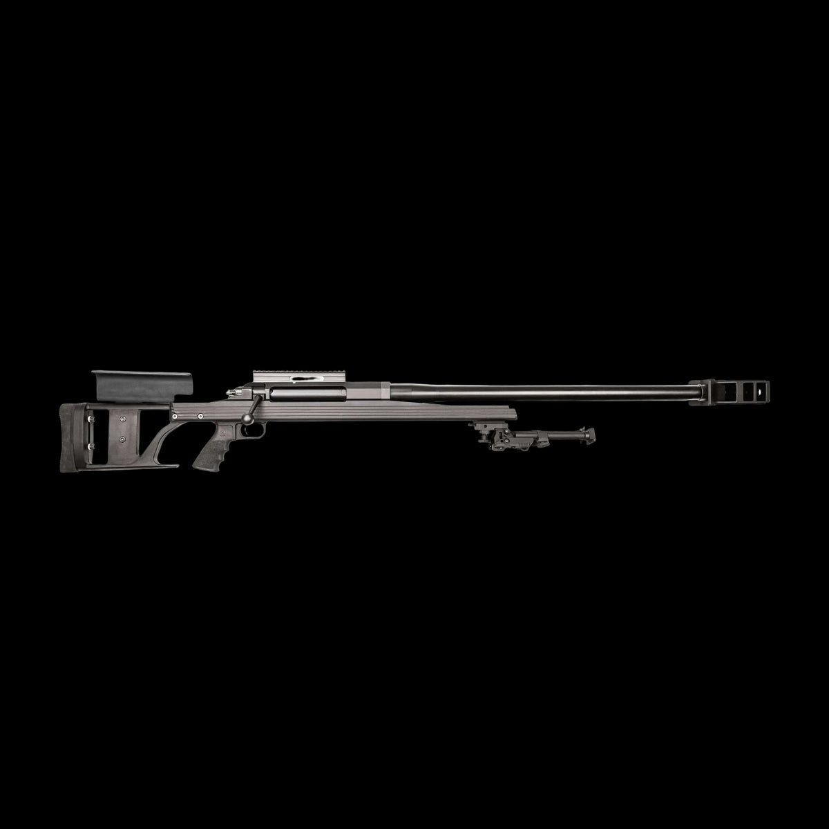 A long-barreled sniper rifle with a black finish, the B&B Firearms Armalite AR-50 A1 is perfect for long-range shooting. Equipped with a sleek stock, rail system for mounting optics, adjustable cheek rest, and a bipod beneath the barrel for stability, it also features a distinctive muzzle brake at the end.