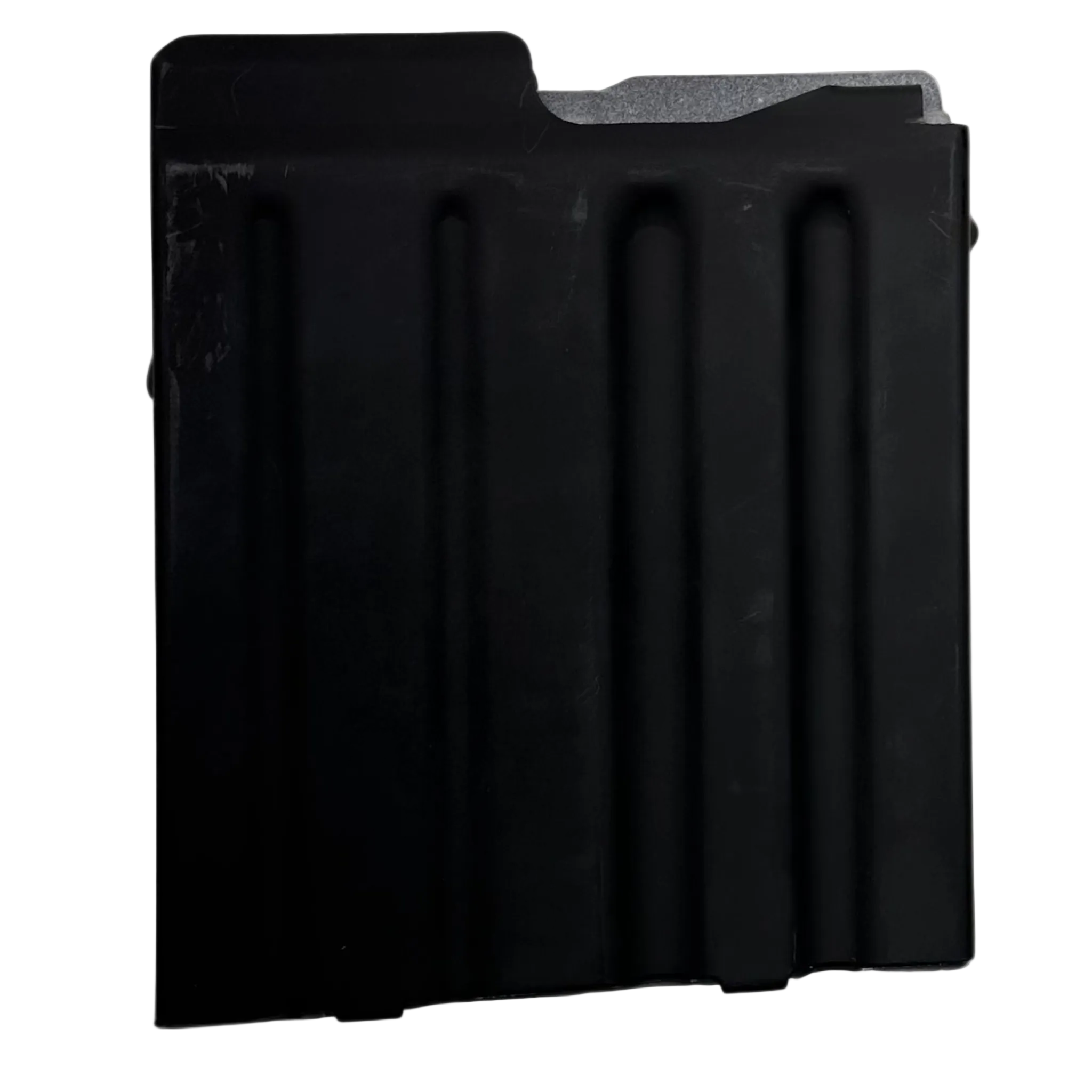 A black rectangular metal object with three vertical indentations resembles a component of the Cheytac M200 .408/.375 Magazine. The right edge features a protruding notch-like structure, and the upper right corner is slightly angled. The matte surface shows signs of mild wear, set against a solid white background. This product is manufactured by B&B Firearms.