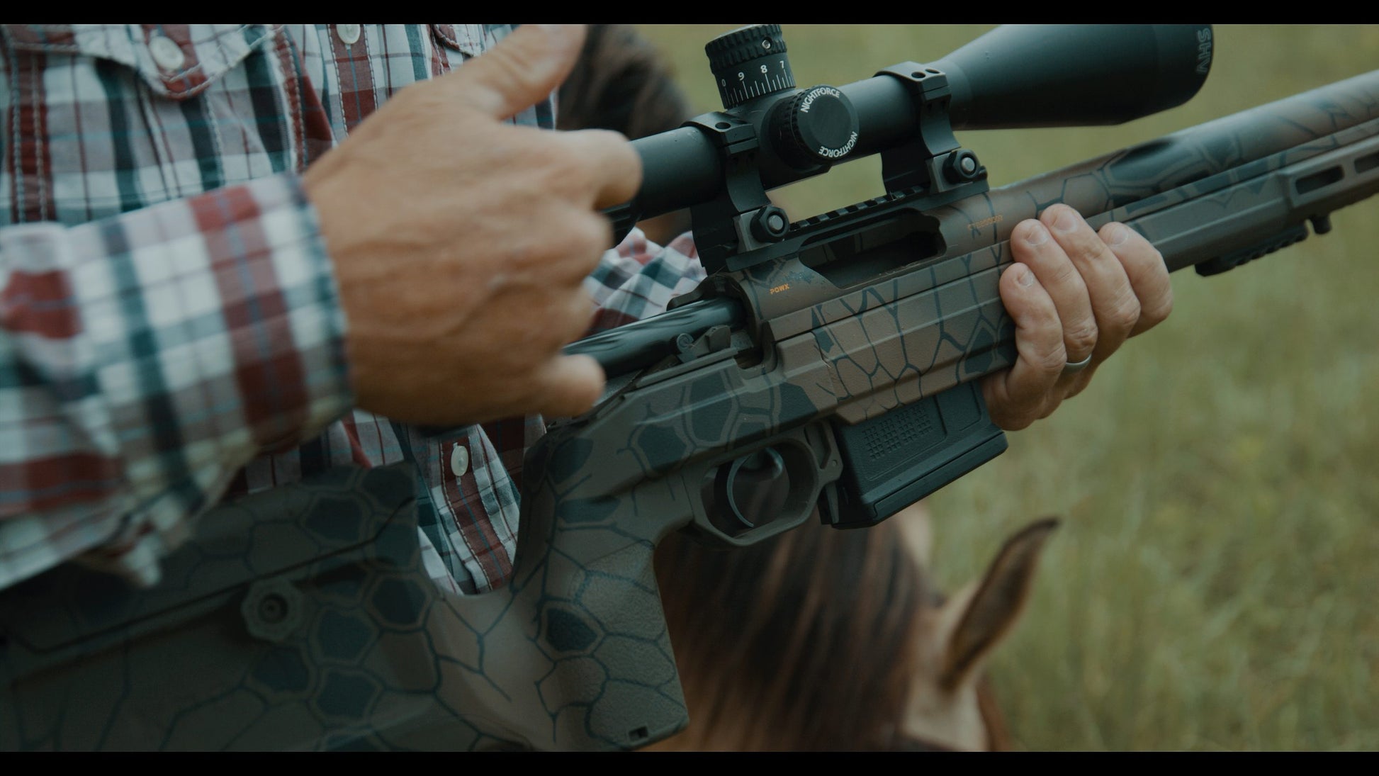 Image of a black precision sniper rifle with a long barrel, an elevated scope, and a bipod attached to the front end. The adjustable stock features a cheek rest, reminiscent of the KRG Whiskey 3. The sleek design indicates it is made for high accuracy shooting. This B&B Firearms CheyTac SAPP rifle is displayed against a plain white background.