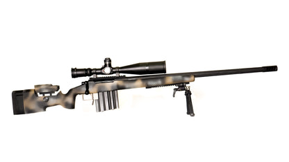 The lightweight **Cheytac M300 Praetorian sniper rifle by B&B Firearms**, favored by competitive shooters, features a long barrel with a bipod near the muzzle, a large scope on top, and a camouflage-patterned stock. Its ergonomic design includes an adjustable cheek rest and a magazine protruding from the bottom. The background is white.